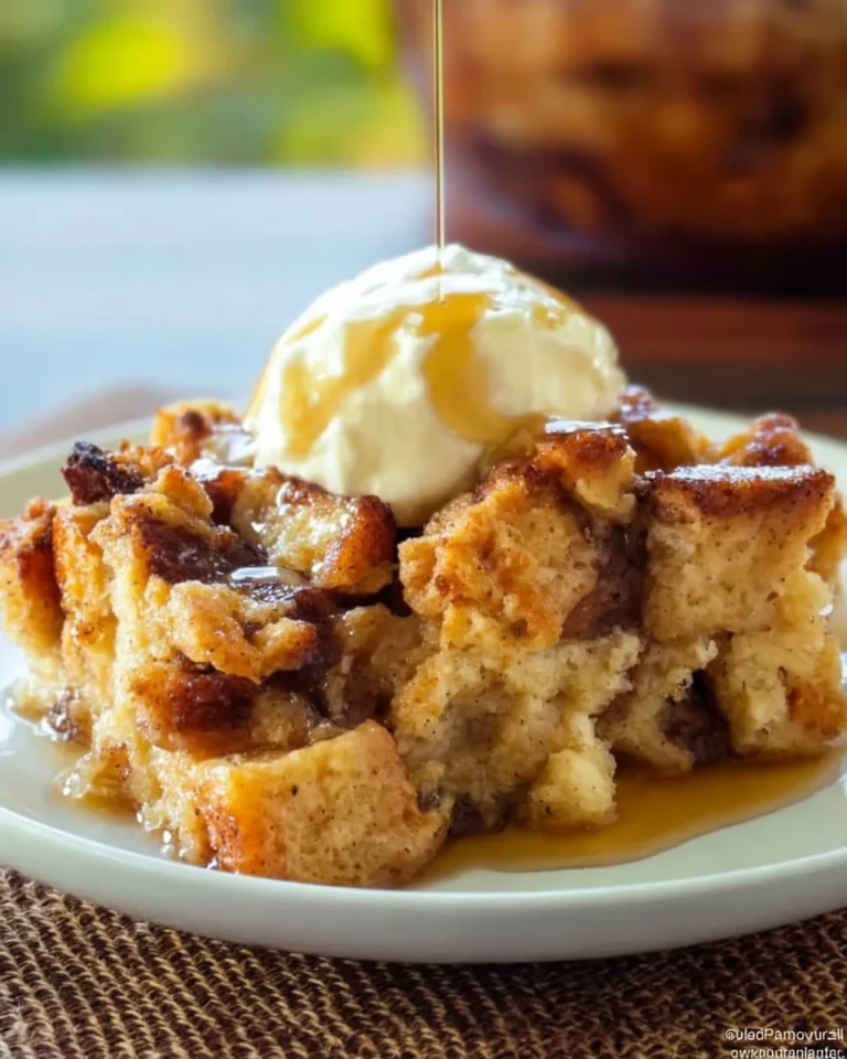 Delicious Slow Cooker Bread Pudding served in a bowl with whipped cream