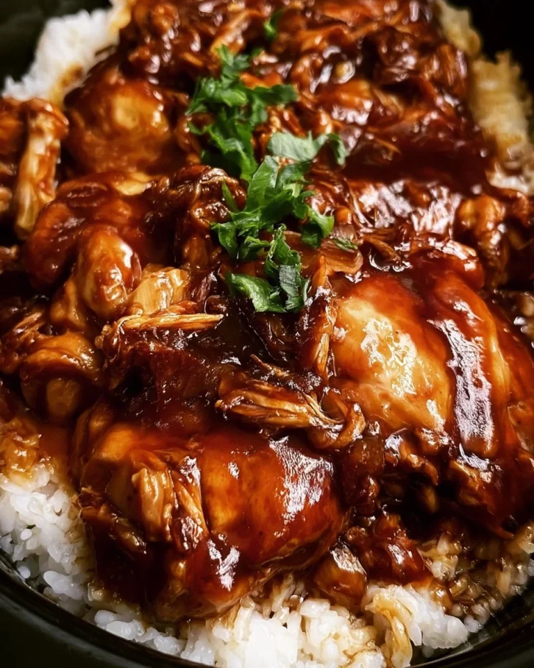 Crockpot Honey Garlic Chicken dish served with rice and vegetables.