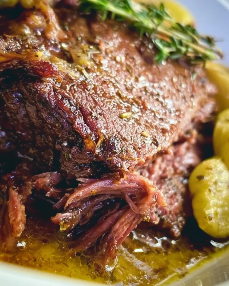 Delicious Mississippi Pot Roast served with vegetables on a plate.