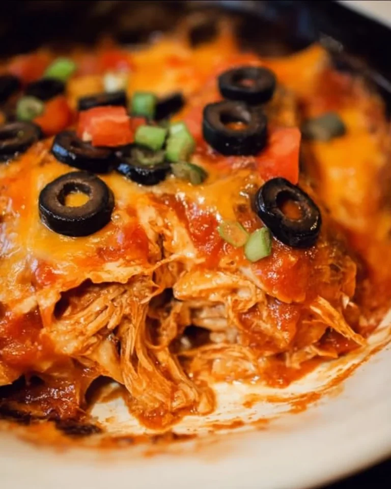 Delicious Slow Cooker Chicken Enchilada Casserole served in a dish