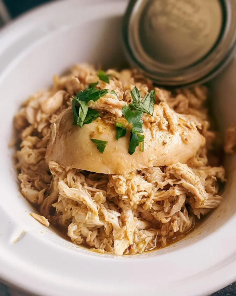 Delicious crockpot shredded chicken dish served with toppings