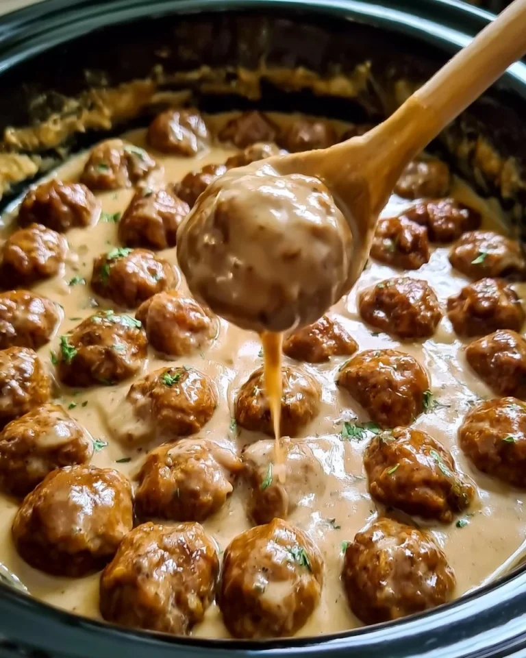 Slow cooker Swedish meatballs with rich gravy served in a bowl