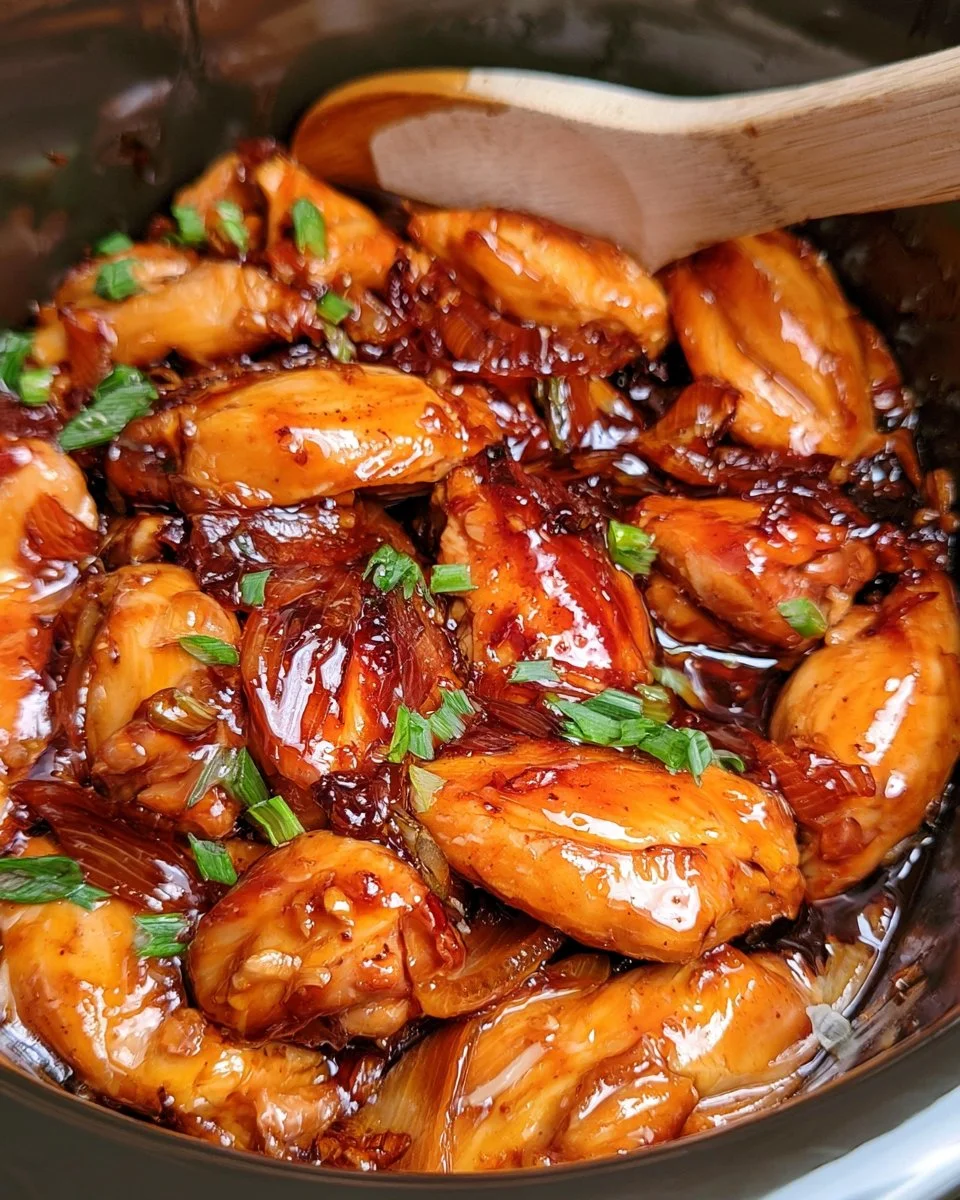 Slow cooker honey garlic chicken with fresh vegetables and herbs